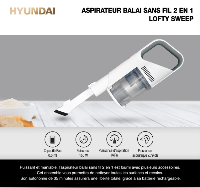 aspirateur balai Lofty Sweep aspirant des miettes de pain sur une table 
