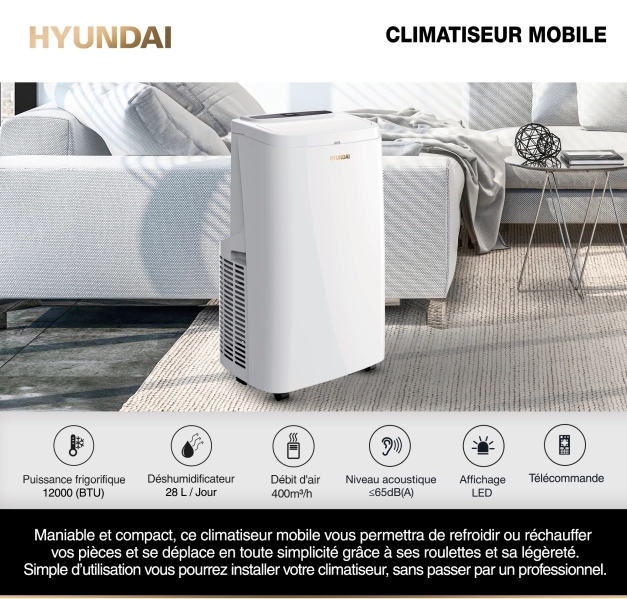 Climatiseur Hyundai réversible 12 000 BTU sur un tapis dans salon à coté d'un canapé